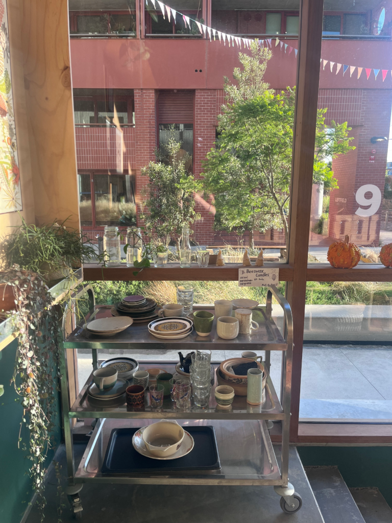 Community crockery station at the Wholefoods Unwrapped Collective entrance for a local cuppa while collecting order in Brunswick.
